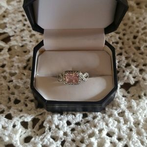 Sterling silver and pink square stone.